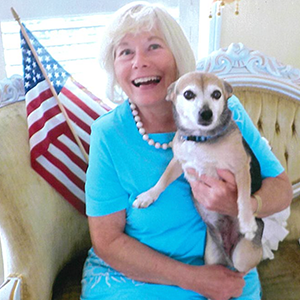 Joan Farrell with Puppy and US Flag